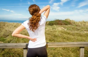 woman with back pain using prolotherapy treatment