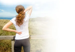 woman with back pain using prolotherapy treatment